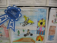 The Best of Kittitas County Coloring Contest Entry - Drawing of a person jumping a snowmobile, a person jumping a bike, and a fair with a ferris wheel