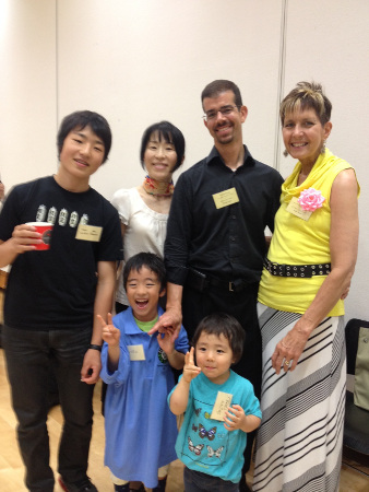 Rick Sader and wife with host family